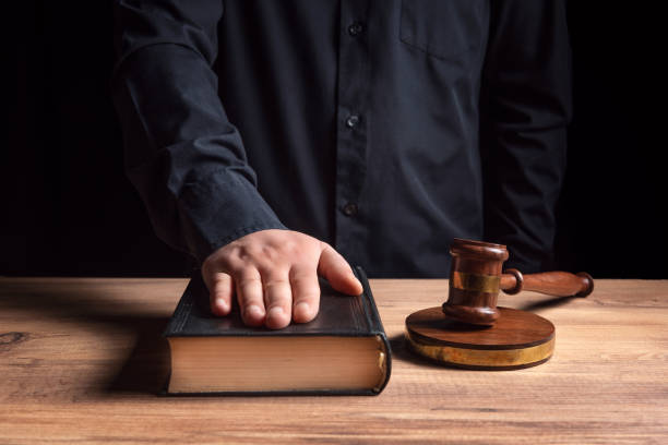 Concept of Justice. Judges gavel, book and oath